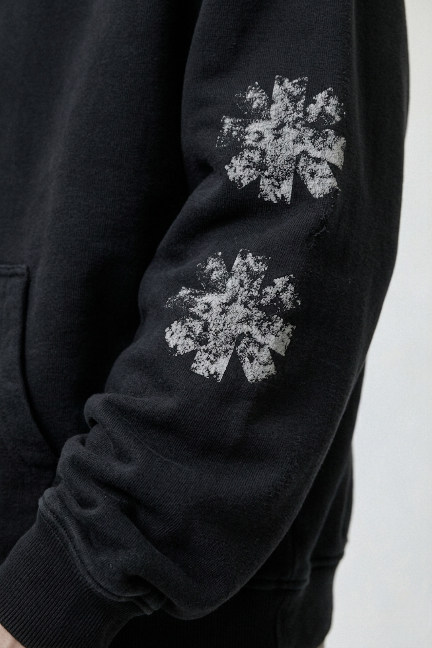 Distressed asterisk print sleeve detail
